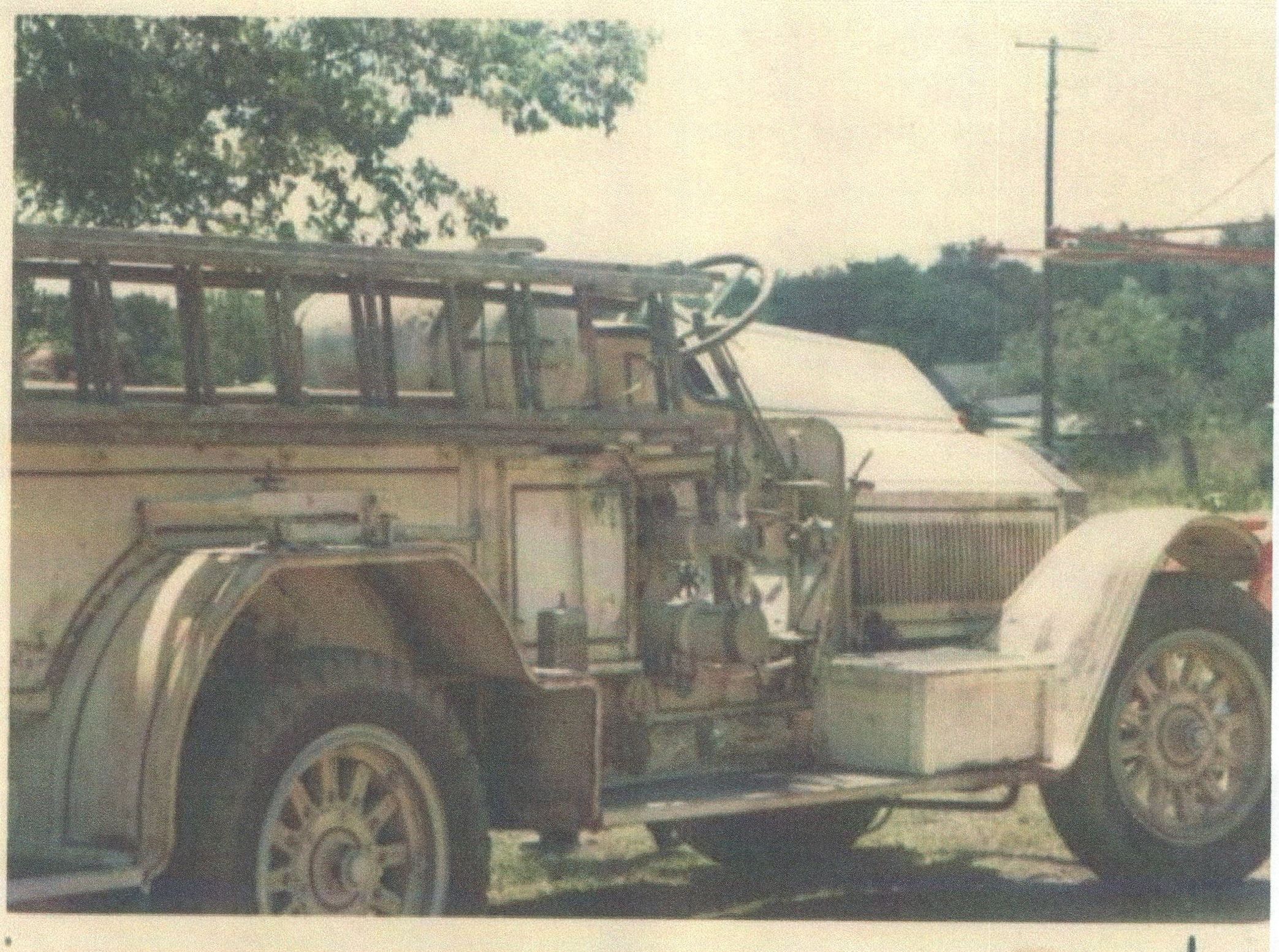 1923 fire engine working on a scene 